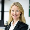 Blonde woman around 35 smiling professional-1
