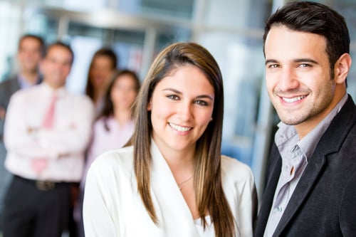 Happy business team smiling at the office